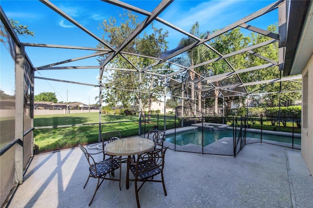 view of pool featuring an in ground hot tub, a patio, glass enclosure, and a lawn