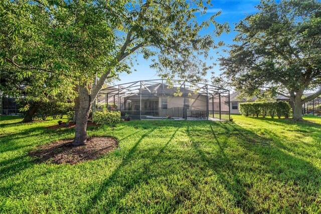 view of yard featuring a lanai