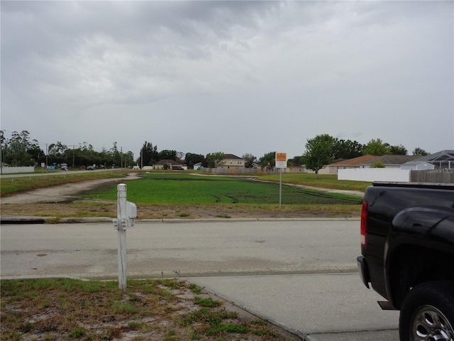 view of street featuring curbs and sidewalks