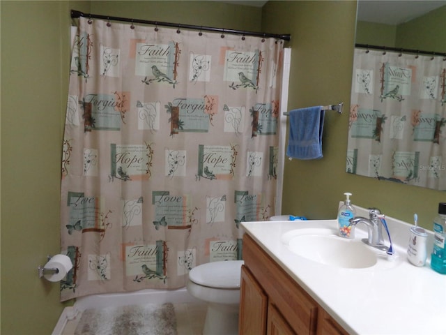 bathroom featuring a shower with shower curtain, vanity, toilet, and tile patterned floors