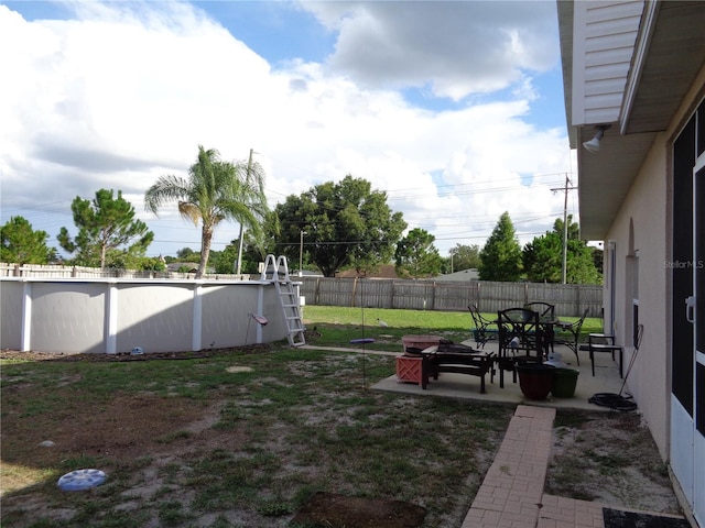 view of yard featuring a patio and a fenced backyard