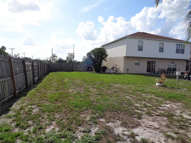 view of yard with a fenced backyard