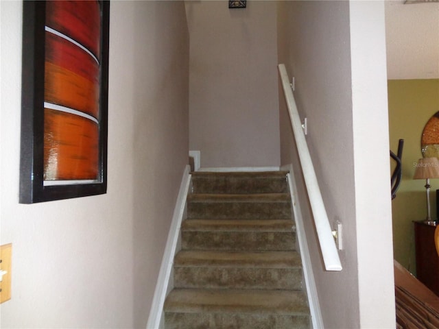 stairway with baseboards