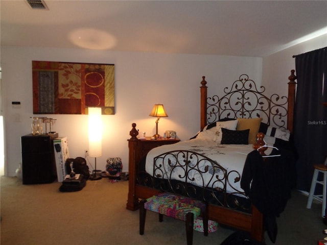 bedroom featuring carpet and visible vents