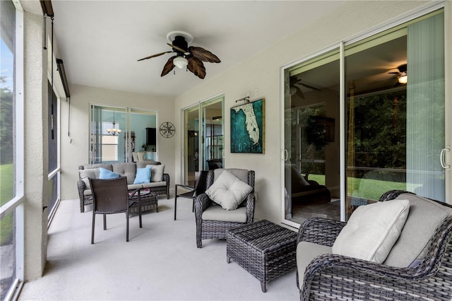 sunroom featuring ceiling fan