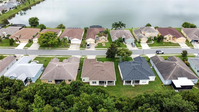 bird's eye view with a water view