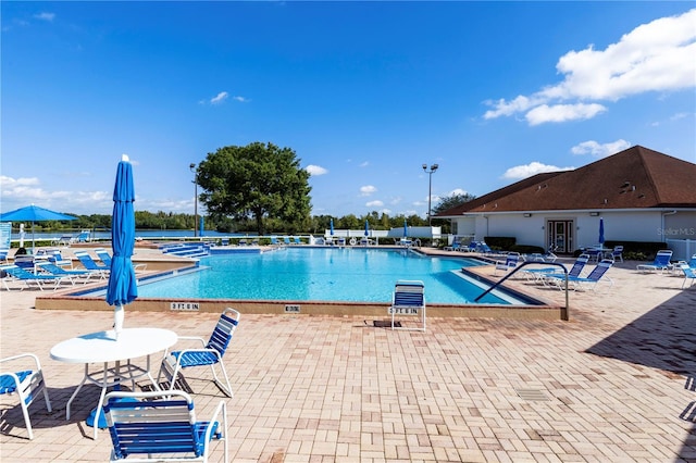 view of swimming pool with a patio area