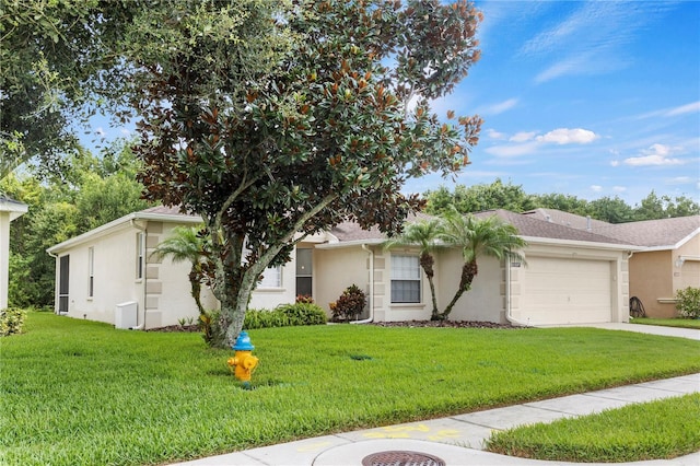 ranch-style home with a front yard and a garage