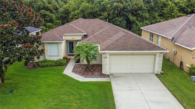 view of front of property with a garage and a front yard