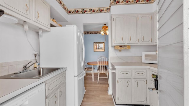 1600 W Lake Parker Dr Unit A2, Lakeland, FL 33805 - kitchen featuring a sink, white appliances, light wood finished floors, ceiling fan, and light countertops