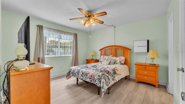 1600 W Lake Parker Dr Unit A2, Lakeland, FL 33805 - bedroom with ceiling fan, baseboards, and light wood-type flooring