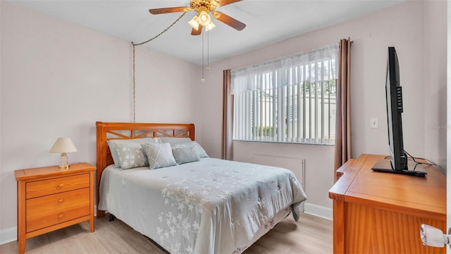1600 W Lake Parker Dr Unit A2, Lakeland, FL 33805 - bedroom with baseboards, light wood-style flooring, and ceiling fan
