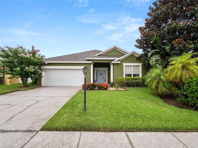 view of front of house with a garage and a front lawn