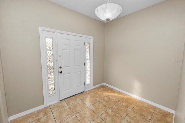 tiled entryway with a healthy amount of sunlight