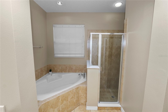 bathroom featuring plus walk in shower