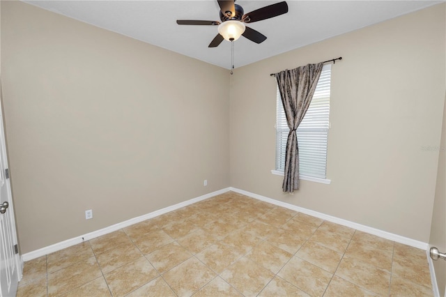 spare room featuring ceiling fan and light tile patterned floors