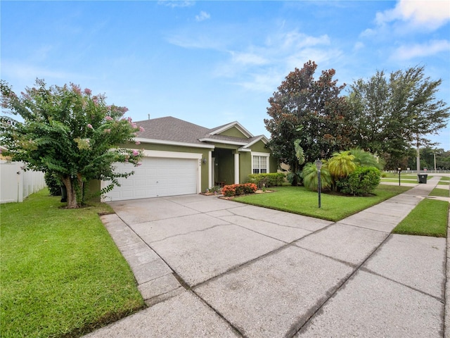 view of front of house with a garage and a front yard