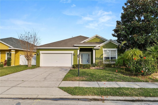 view of front of property featuring a garage and a front lawn