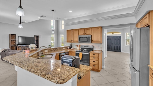 kitchen featuring stainless steel appliances, ornamental molding, sink, and pendant lighting