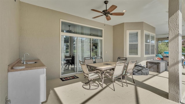 view of patio / terrace featuring sink and ceiling fan