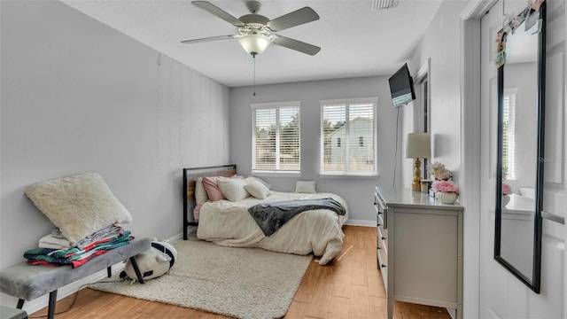 bedroom featuring ceiling fan and light hardwood / wood-style floors