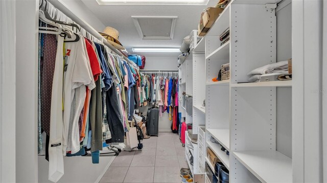 walk in closet featuring light tile patterned floors