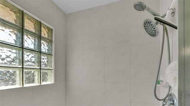 interior space featuring tiled shower