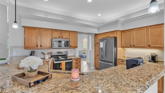 kitchen with hanging light fixtures, light tile patterned floors, ornamental molding, kitchen peninsula, and stainless steel appliances