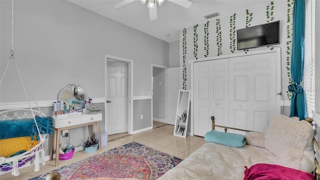 interior space with ceiling fan and a closet