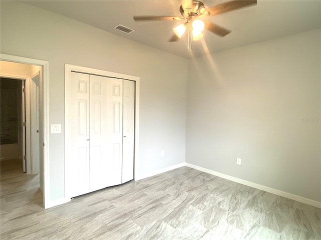 unfurnished bedroom with visible vents, baseboards, a closet, and a ceiling fan