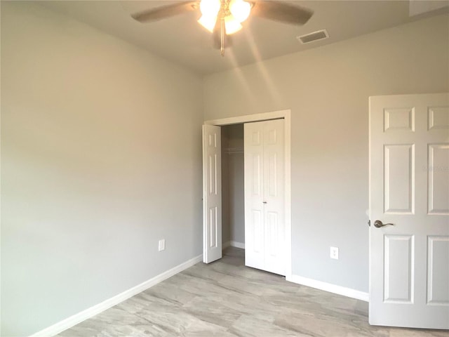 unfurnished bedroom featuring a closet and ceiling fan