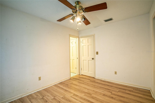 unfurnished room with ceiling fan and light hardwood / wood-style flooring