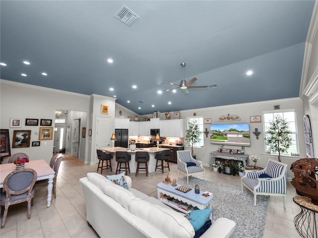 living room featuring ceiling fan, light tile patterned flooring, and high vaulted ceiling