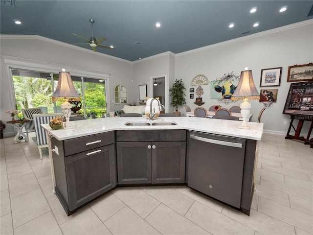 kitchen with dark brown cabinets, sink, stainless steel dishwasher, and an island with sink