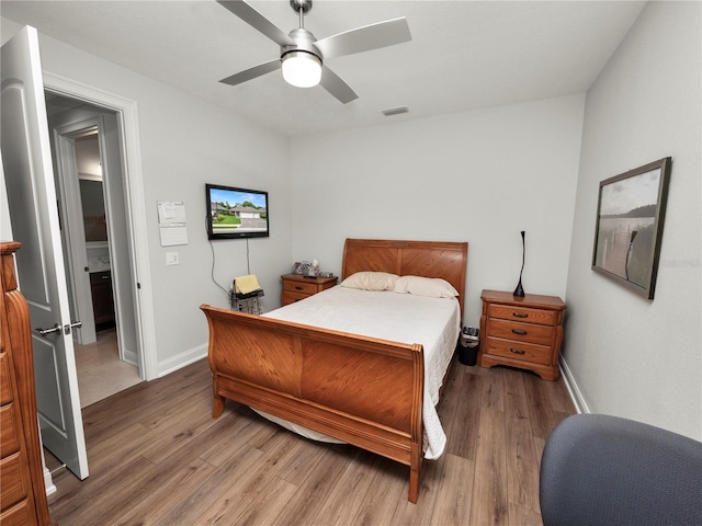 bedroom with ceiling fan and hardwood / wood-style flooring