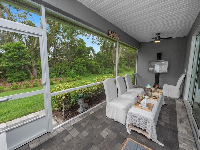 sunroom / solarium with ceiling fan