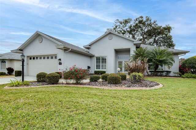 ranch-style home with a front lawn and a garage