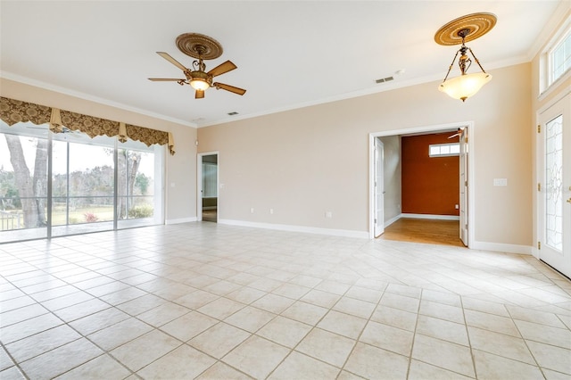 tiled empty room featuring ceiling fan and ornamental molding