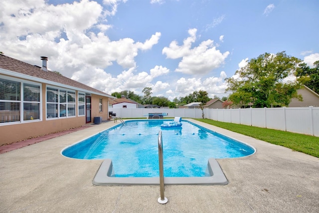 view of swimming pool featuring a patio