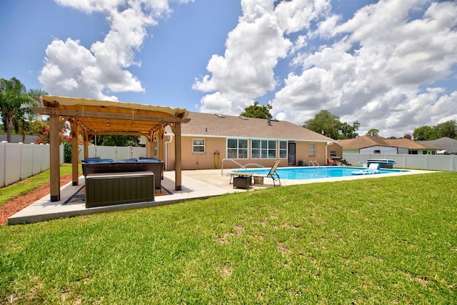 rear view of house featuring a pool with hot tub, a patio area, a yard, and a pergola