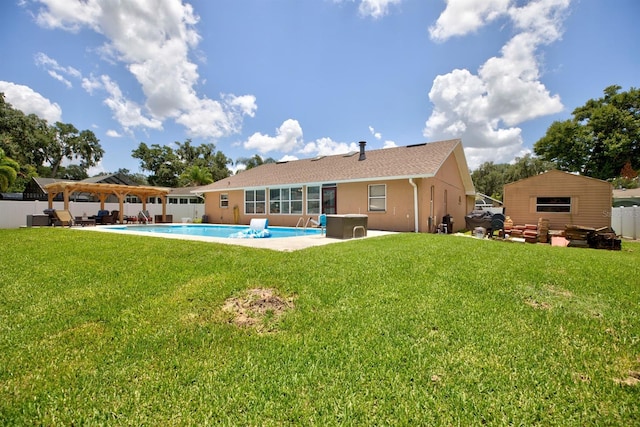 back of house with a pergola and a yard