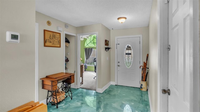 entryway with a textured ceiling