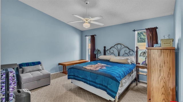 bedroom featuring carpet, a textured ceiling, vaulted ceiling, and ceiling fan