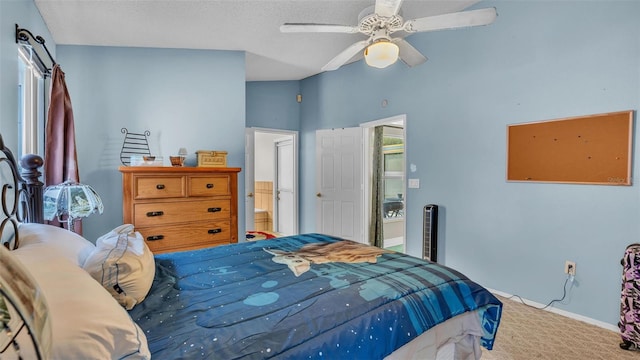 carpeted bedroom featuring connected bathroom and ceiling fan