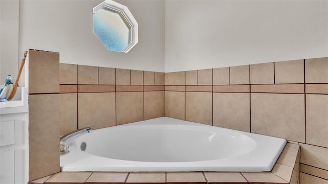 bathroom featuring a relaxing tiled tub