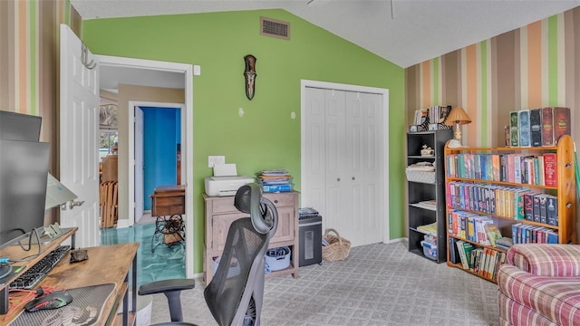 office space featuring vaulted ceiling and light carpet