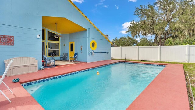 view of pool featuring a patio and ceiling fan