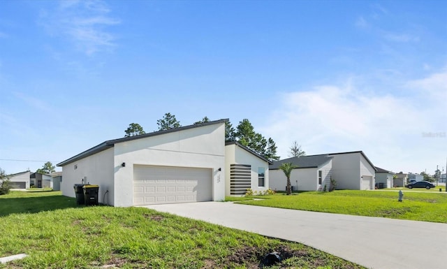 view of front of home featuring a garage and a front lawn