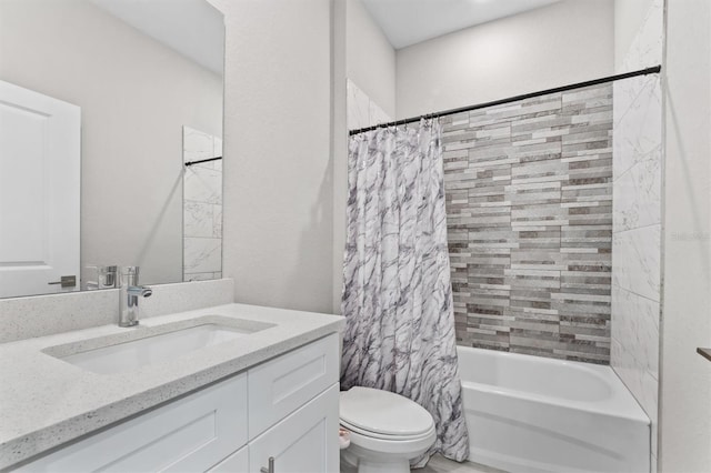 full bathroom featuring shower / tub combo, vanity, and toilet