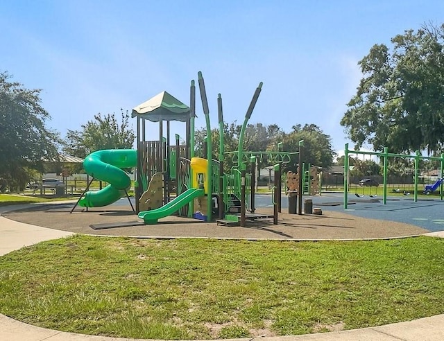 view of jungle gym with a lawn